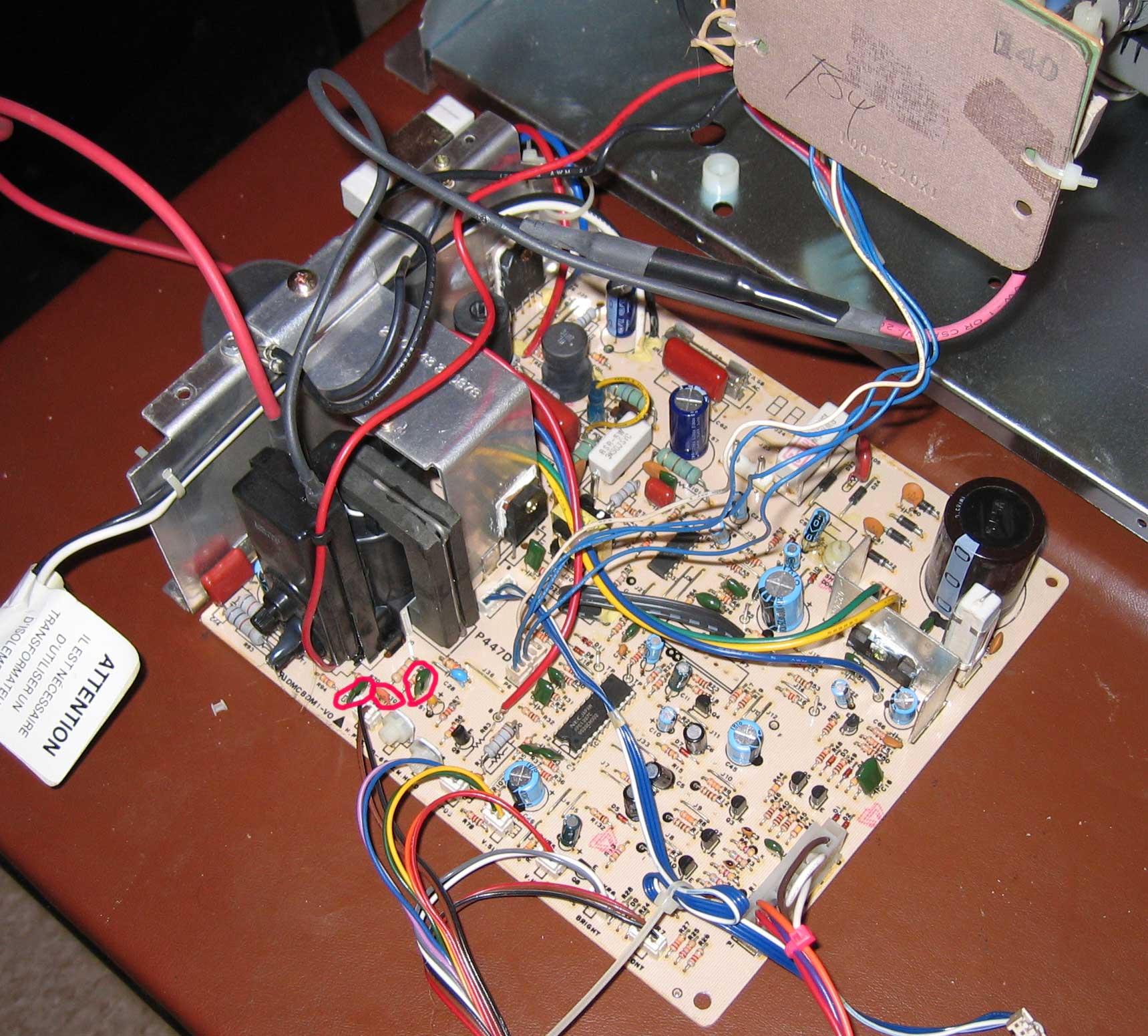 Close-up of the monitor chasis board with C29-C31 circled